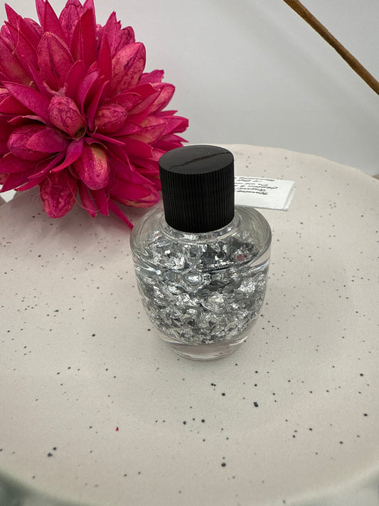 Silver flakes in bottle